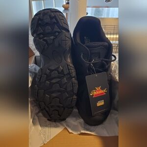 Black Athletic Shoes with Rugged Soles and Safety Features